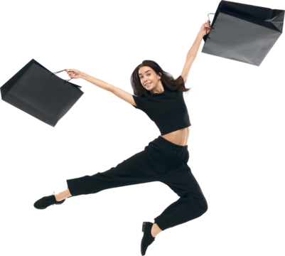 Portrait of young cheerful woman wearing fashion outfit raising hands and holding bags in hands isolated on white studio color background. Concept of Black Friday, Cyber Monday, fashion, sales. Ad