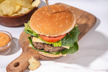 Tasty beef meat burger  with potato chips