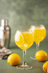 Homemade Limoncello spritz drink of liqueur, sparkling wine and lemon in cocktail glass