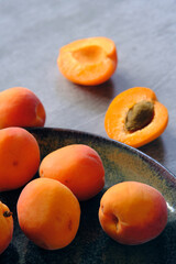 a plate of fresh ripe apricots