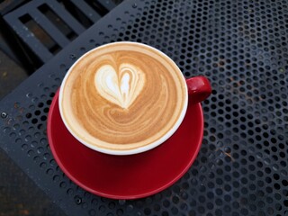 Latte art with a love motif on a coffee latte