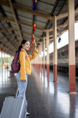 A woman wearing a yellow jacket