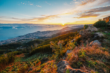 beautiful sunset over the city of Funchal on Madeira from the location Miradouro do Pico Alto....