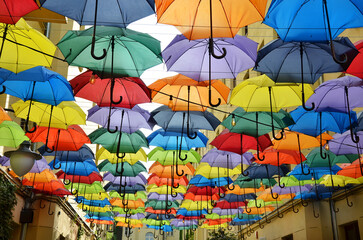 Colorful umbrellas hanging as street decoration