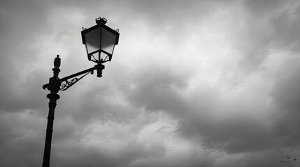 Classic iron lamp post with overcast sky, grey clouds filling the sky