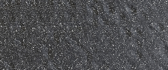 Dark gray speckled concrete wall with white dots. Texture for composition. Mockup, copy space, background.