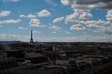 Fototapeta premium Sightseeing in Paris through Montmartre, the Latin Quarter, Notre Dame, the Eiffel Tower, the Champs Elysées, the Louvre Museum and the streets with ancient buildings, in the year of the Olympic Games