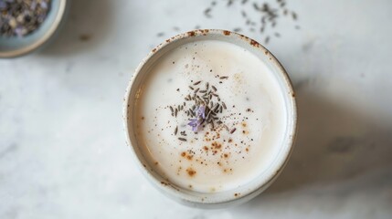 Warm Earl Grey tea latte with lavender garnish