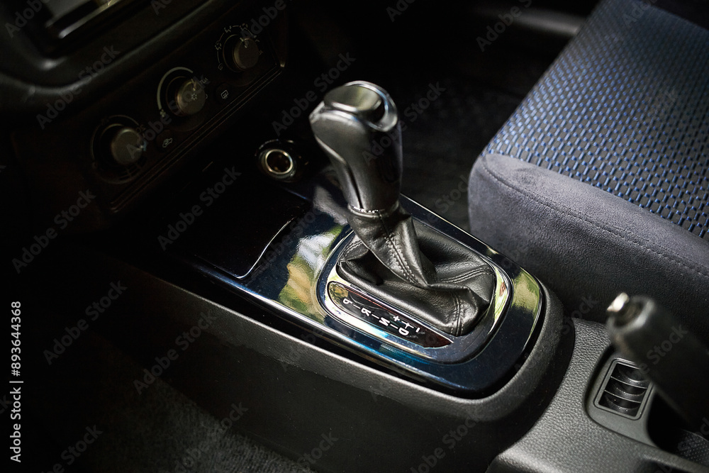 Wall mural Car shift lever. Inside a modern car view, city car interior background