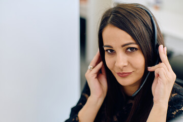 Friendly Call Center Agent Answering Incoming Calls with Headset Providing Remote Customer Service.