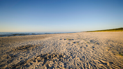 A wonderful wide, fine sand beach in the afternoon sun. Baltic Sea, Slajszewo, Poland