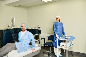 Obraz premium A man in scrubs sits on a hospital bed.