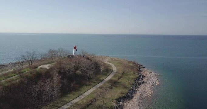 Flying over lighthouse Close to the sea
Tommy Thompson Park lighthouse, Toronto, Canada
