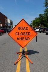 close up or orange road sign 