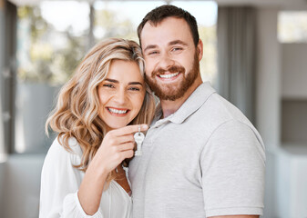 Couple, happy and portrait with keys for real estate, moving and celebration in new house together. Man, woman and face in lounge with profile picture for property investment, rental or mortgage loan