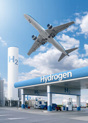 Fuel cell car at the hydrogen filling station and airplane in the sky. Clean mobility concept.