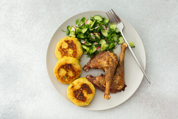 Chickpea cutlets with mixed salad with cucumbers and radishes, baked farm chicken legs, a delicious hearty lunch or dinner
