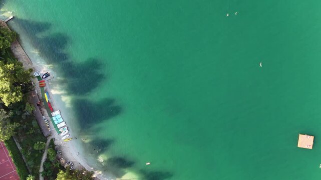 Panning upwards from the beach to Knight Island on the Fethiye peninsula. 4k drone video

