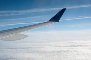 Obraz premium View of the clouds from within, out of the plane
