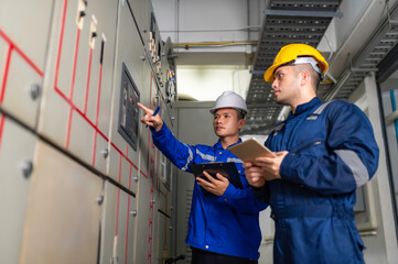 Electrical engineers and technicians work together to solve electrical system failures in...