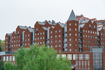 Geometry modern of apartment building exterior. Architectural details of luxury house and home complex. Fragment contemporary residential condominium. New multistorey skyscrapers in business district.