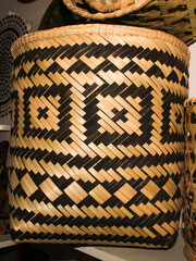 Indigenous basket, indigenous crafts woven with plant fiber, in a two-color geometric pattern,...