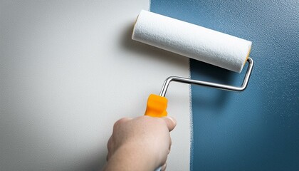 Obraz premium closeup painting a wall with roller