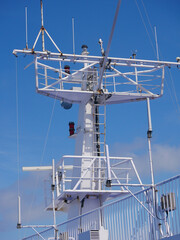 Radar antennas on board of a cruise ferry ship. Navigation system of the liner. Elements of radio location equipment in the ultrasonic wave range.