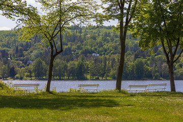 Benches on the edge of the water of the dam. Brno Dam - Czech Republic Europe.