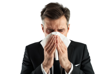 Sick businessman blowing nose using tissue paper isolated on white background