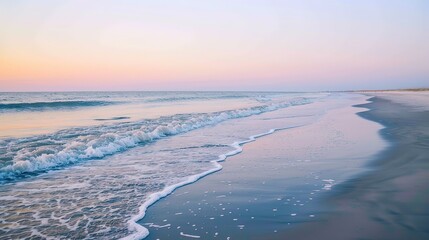 Tranquil Ocean Waves Crashing on Sandy Beach at Sunset
