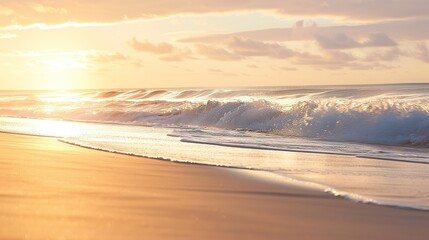 Obraz premium Gentle Waves Crashing on Sandy Beach at Sunrise