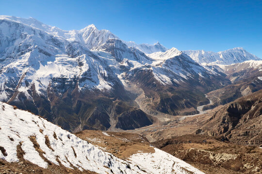 On the way to the Ice Lake, view onto the town of Manang in front of Annapurna III, Gangapurna, Tarke Kang and Khangsar, Kangshar, Kangsar Kang, Annapurna Circuit Trek, Nepal