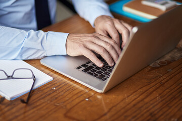 Business man, laptop and hands for typing email in office, feedback and planning for proposal. Male...