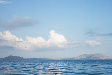 Seascape with a cloud in the sky.
