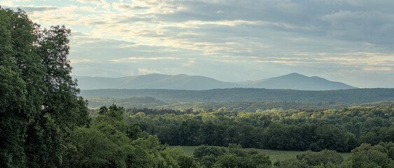 beautiful sunset in the mountains (slide mountain hudson valley catskills) catskill range with forest trees in the foreground landscape travel hiking camping destination new york upstate © Yuriy T