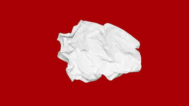 Stop motion animation of crumpled paper on a red background