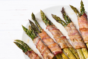 Fried asparagus rolled with bacon meat