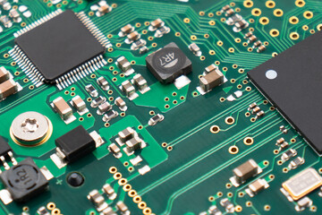 Circuit board with resistors microchips and electronic components background. Computer hardware...