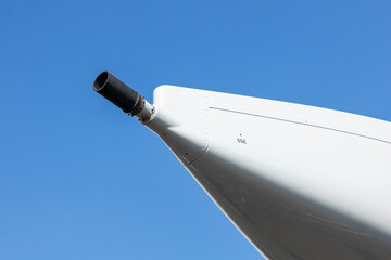 Closeup of a fuel dump nozzle on the wing of a widebody aircraft