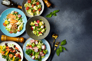 A set of vegetable dishes with seafood, veal and chicken. Top view.