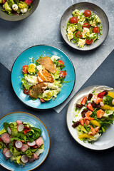 Food. A set of salads from fresh vegetables. Colorful appetizing salads. Top view.