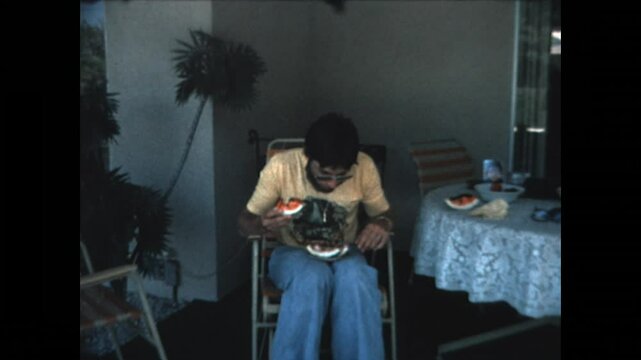 Eating Watermelon 1978 - A young man eats watermelon and spits out the seeds in 1978.