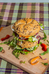 Wooden board with tasty fresh vegan and vegetarian sandwich 