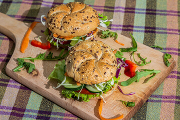 Wooden board with tasty fresh vegan and vegetarian sandwich 
