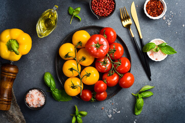Healthy food background. Healthy food concept, fresh tomatoes, vegetables and spices. Organic food. Free space for text.