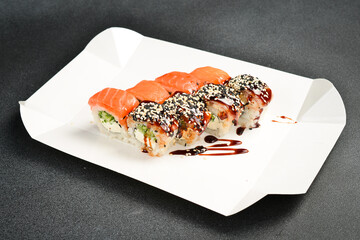 Japanese salmon and eel sushi rolls with Philadelphia cheese. Food delivery. close up