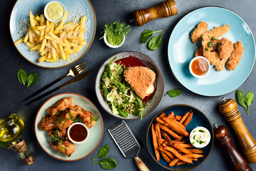 Set of food and dishes and snacks on stone table. Restaurant dishes. Menu mockup. Top view.