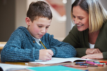 Woman, kid and homework with paper on table for learning, knowledge and support in studying. Happy,...