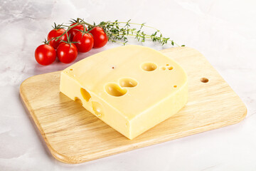Maasdam cheese brick over board